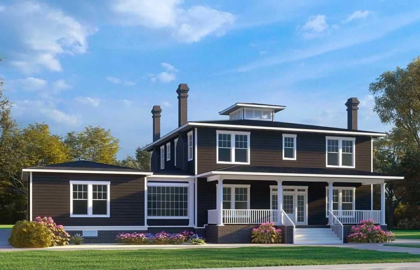 Modern two-story dark blue house with white trim, brick foundation, front porch, and landscaped garden under blue sky.